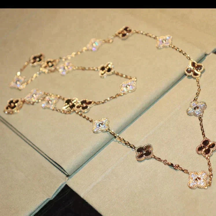 {
  "Elowen jewelsry": "Elowen Schmuck",
  "CLOVER 20 MOTIFS LASER DIAMOND NECKLACE": "KLEEBLATT 20 MOTIVE LASER-DIAMANT-HALSKETTE"
}