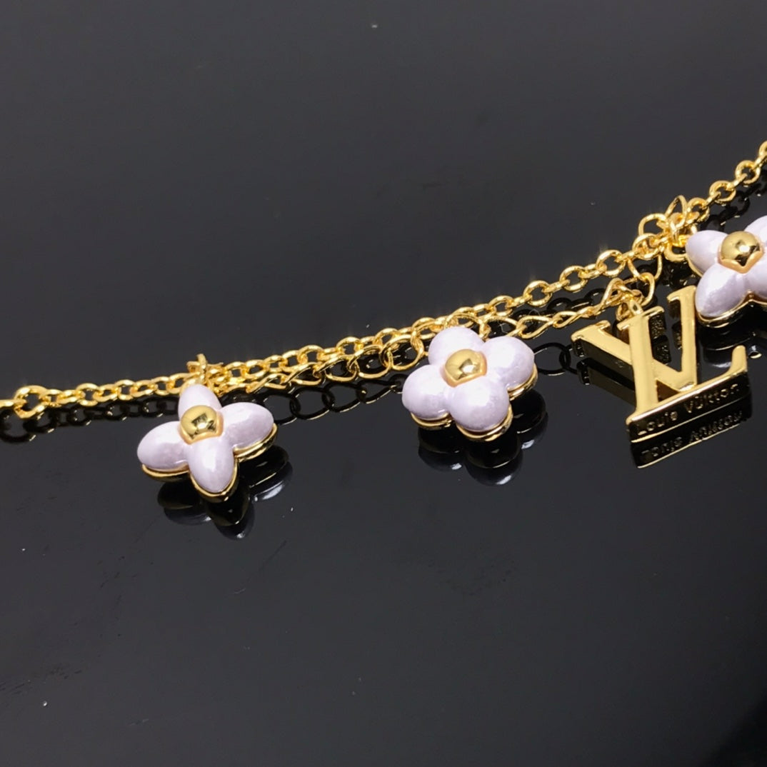 {
  "Elowen jewelsry": "Elowen Schmuck",
  "LOGO 6 MOTIF STAR AND SUN GOLD BRACELET": "GOLDARMBAND MIT 6 STERN- UND SONNENMOTIVEN"
}